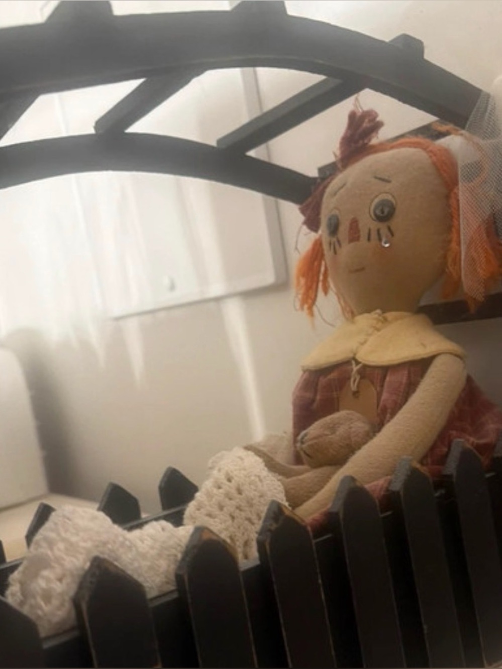 Handcrafted black wood canopy bed
Rag Doll Annie lace blanket